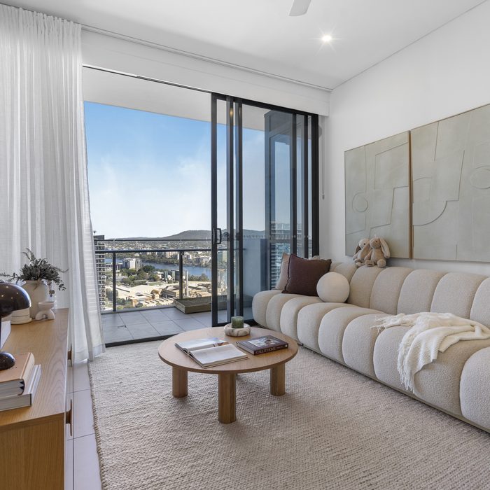 Light filled living room with balcony views